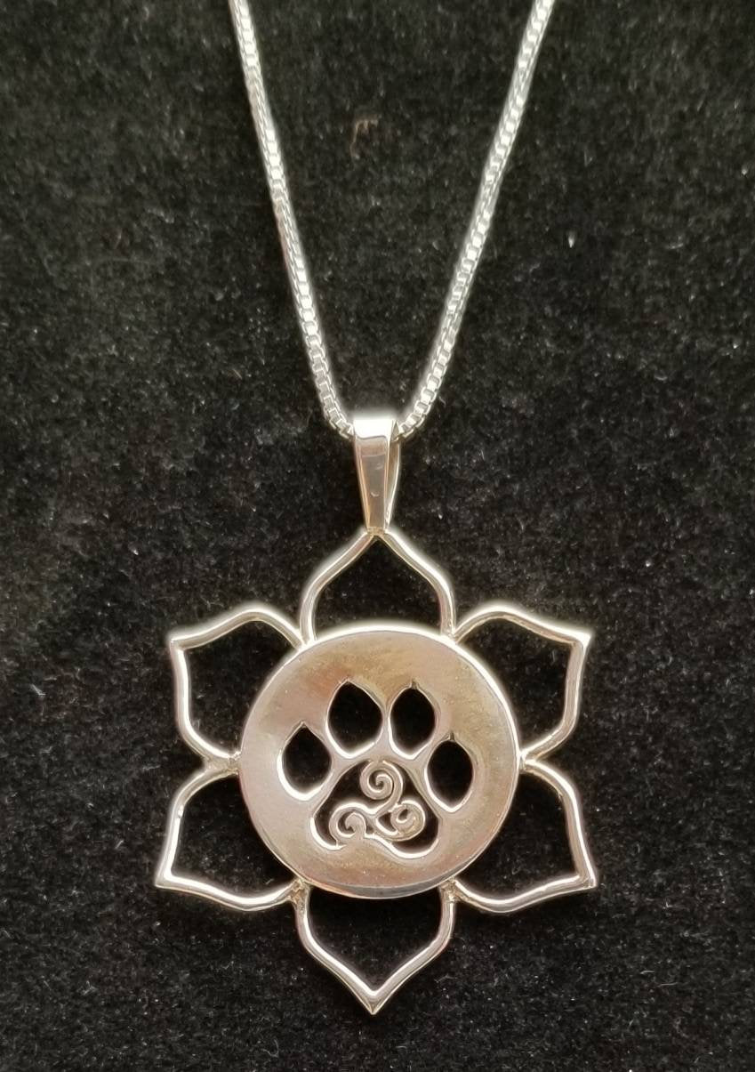 sterling silver dog paw hand sawn silhouette pendant with 6 sterling silver wire pedals and POMC logo design on 18 inch sterling chain for dog or cat lover free ship and gift box